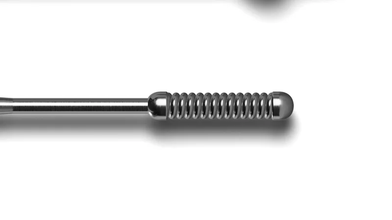 Close-up of a machined guidewire coil tip, rendered in 3D on white
